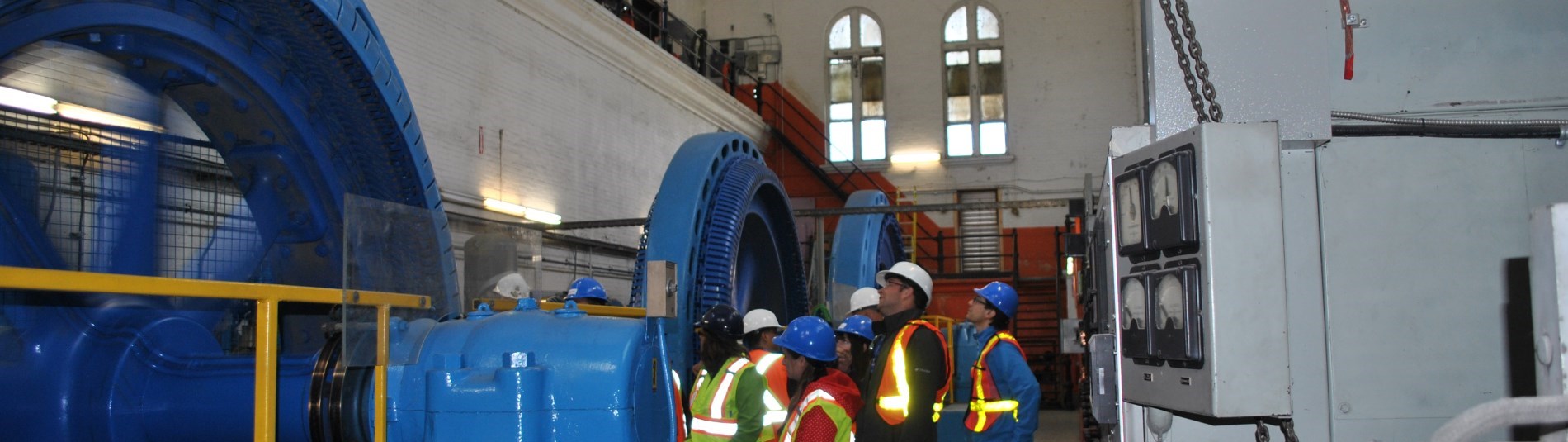group of people looking at a generator